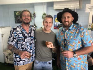 three mates enjoying beers at Happy Valley Brewing Co on a Northern Exposure brewery tour